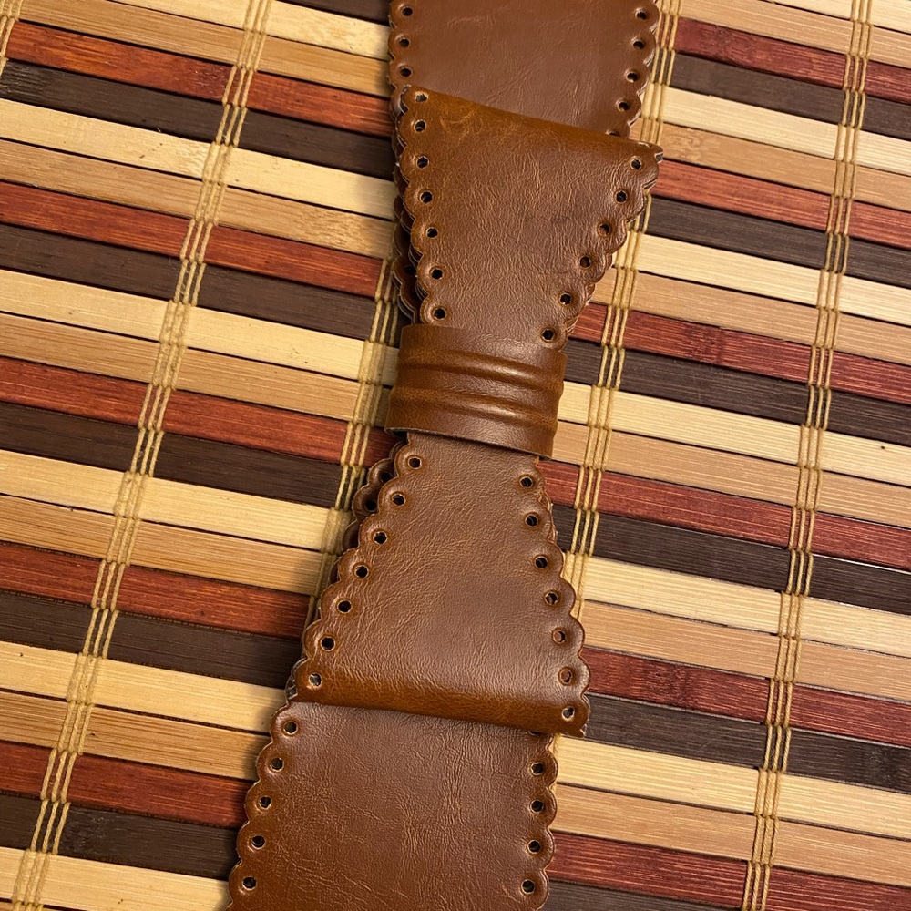 3/$25.  Torrid, man made leather belt, stretch, light brown, gently used